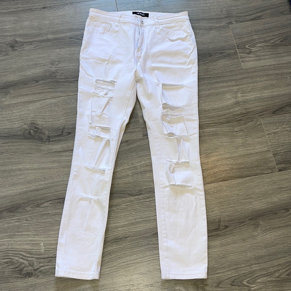 Pre loved white ripped up stretchy jeans.
